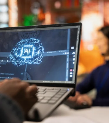 call-center-worker-using-ai-tech-laptop-reply-customers-closeup Revolutionizing Patient Triage with AI Agents
